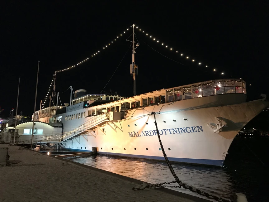 Lit up harboured ship