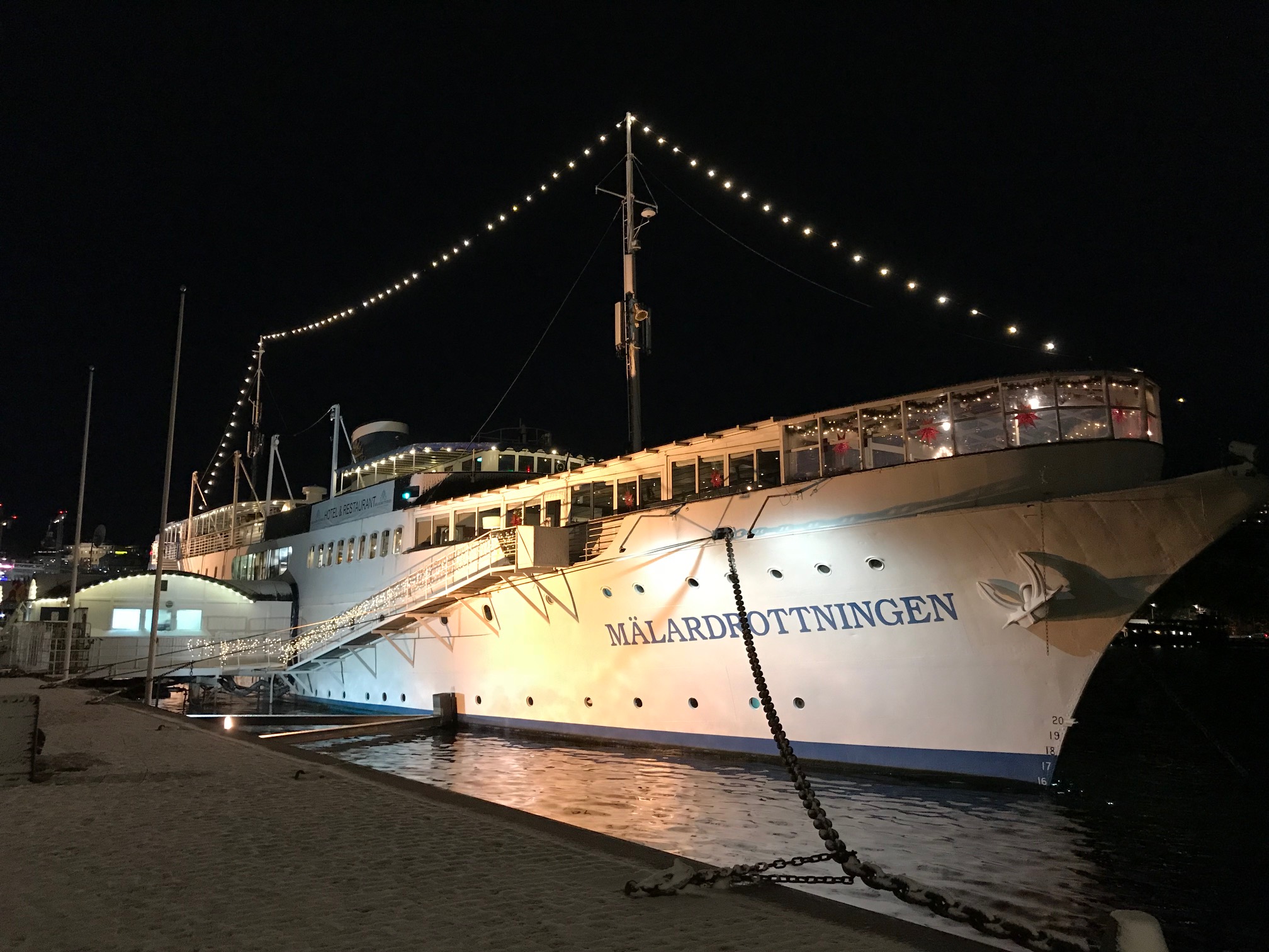 Lit up harboured ship