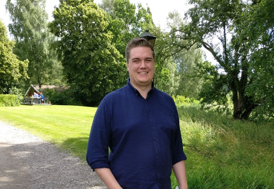 Smiling man in park