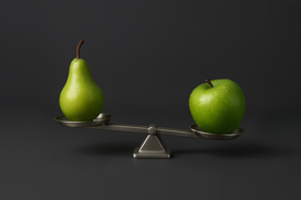 An apple in one scale and a pear in the other.