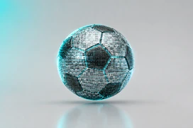 Digital fotboll gjord av fotomosaikplattor som svävar på grå bakgrund med blå lysande accenter