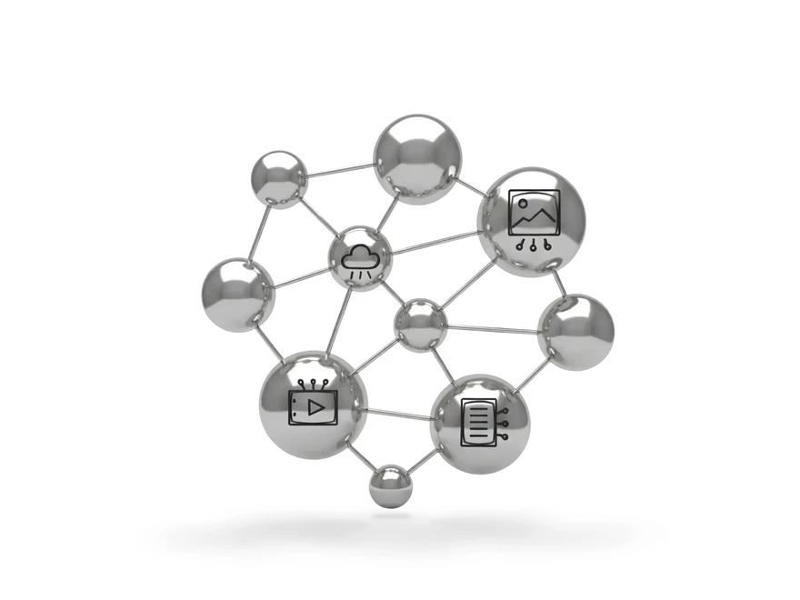 Interconnected metallic spheres with digital icons including cloud storage, image file, video playback, and document management, symbolizing networked data technologies and digital communication.