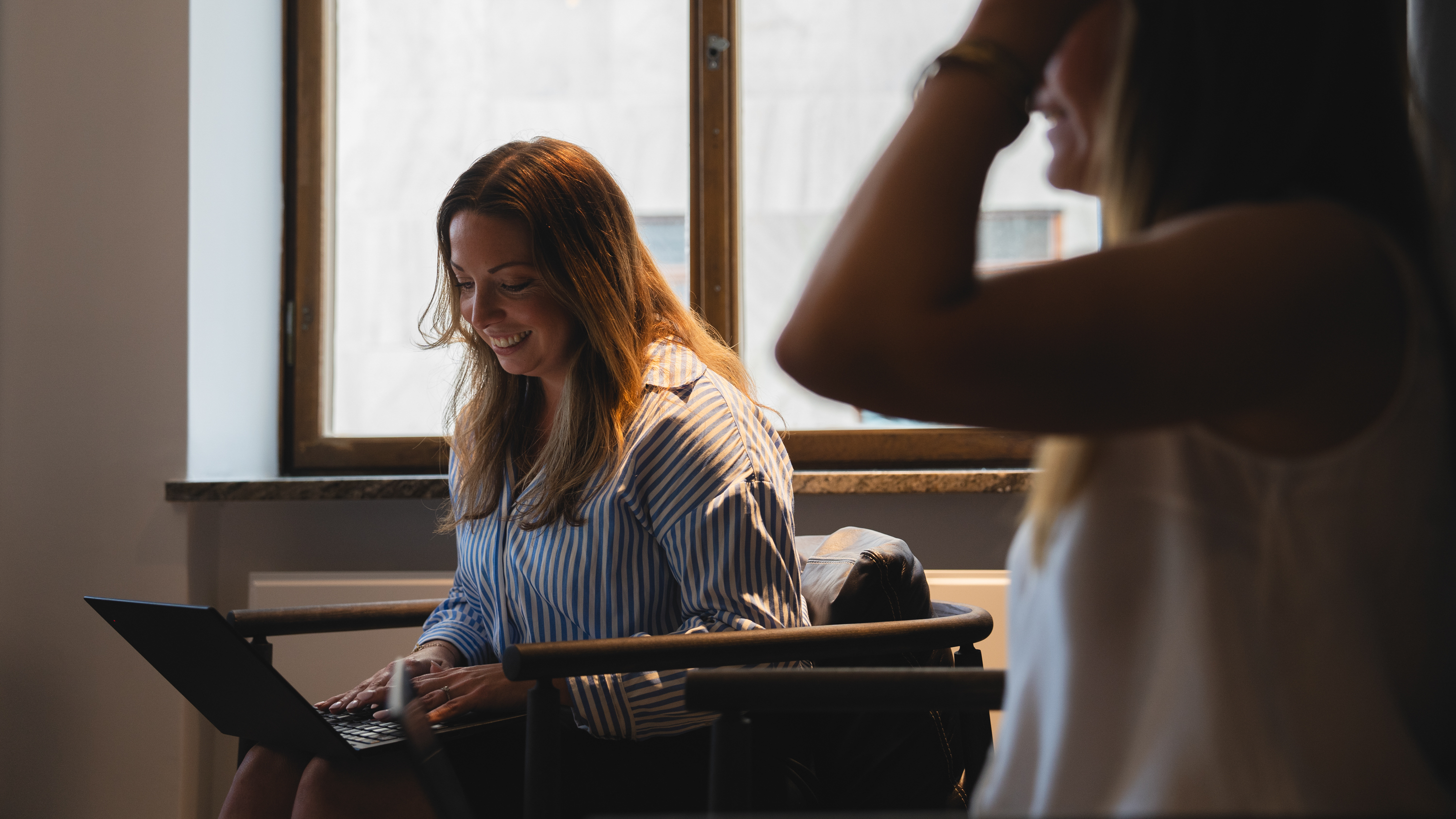 Two people in a meeting room