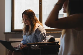Two people in a meeting room