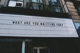 A sign saying What are you waiting for